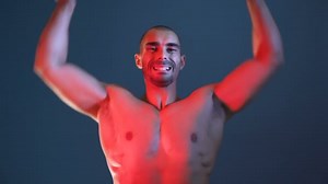 Male Fitness model showing muscular arms, chest and shoulders, posing for photo session