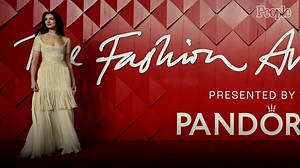 Anne Hathaway Avoids Wardrobe Malfunction with Relatable Dress Tweak in Front of Red Carpet Photographers