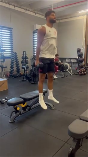 Dead stop squat jumps with db