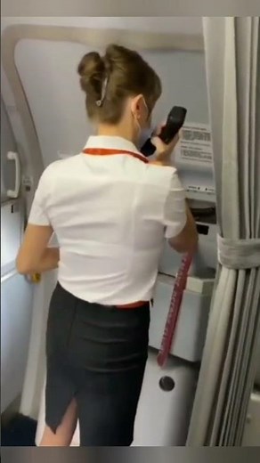 Flight Attendant door opening. Hot Airhostess. Aviation.
