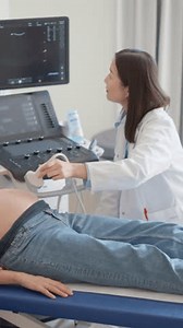 clip-3665313351-vertical-screen-caring-female-hospital-obstetrician ...