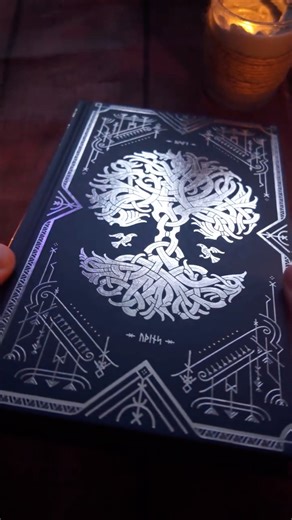 Louis Webb on Instagram: "A legendary relic has been hand delivered to the undead tavern 📜 Hávamál: The wisdom of Ódin by @einarrs_journey . Join me as I unbox and showcase this stunning relic by firelight 🔥 When Connor handed me this I had to stop and just admire it for a minute. This book looks like it was crafted from another realm… the weight, the designs, the overall craftsmanship. It’s the kind of book you want to pick up often and always have on display at the same time. 🤝🏻"