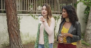 Attractive Women Walking Down Street Using Stock Footage Video (100% Royalty-free) 10758134 | Shutterstock