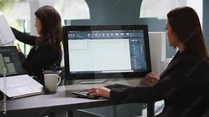 Graphic designer using CAD tool to create layout sketch for property remodeling, working on designing architectural blueprints. Architect developing new floor plan for a household. Handheld shot.