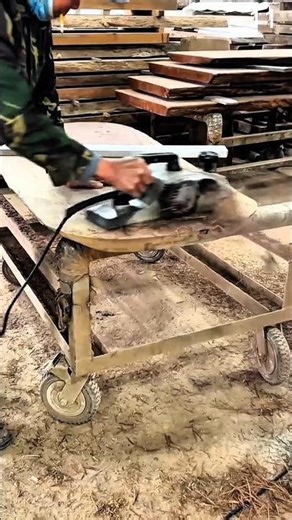 Planing wooden board surface using handheld power planer.