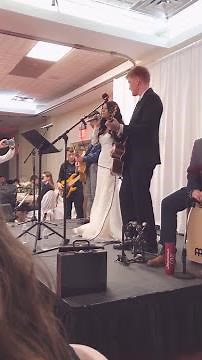 Beautiful bride sings to her groom
