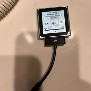 6th gen iPod nano. Plays music, photos, videos, audiobooks, podcasts.