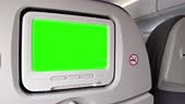 White LCD Screen in an Airplane Seat Turning On Chroma Key Green...