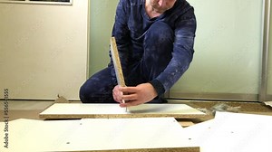 Wooden modular rack. Assembling a modular rack. The man installs the panel on the eccentric rod. Stock Video