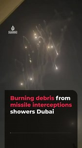 Witness videos captured missile interceptors launching and burning debris raining from the sky near the Dubai International Convention and Exhibition Centre. #news