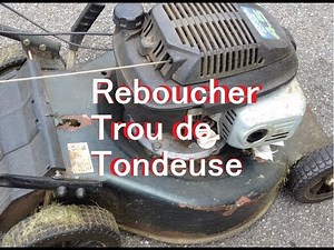 Repairing a rusty and holey lawnmower housing, filling with fiberglass cloth and resin