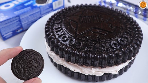 How to Make a Giant OREO Cake #oreo #oreocake Giant Oreo Cake made of chocolate cake layers filled with whipped cream, white chocolate and chopped oreo cookies Ingredients: 1 1/2 cups all purpose flour (or cake flour) 1 cup cocoa powder, unsweetened 1/2 tsp baking soda 1 tsp salt 3/4 cup milk 1/2 tbsp vinegar 1 cup warm water 1/2 tbsp coffee powder 2/3 cup vegetable oil 1 cup packed brown sugar 1 cup white sugar 3 eggs For the filling: 1 cup whipping cream 1 tsp vanilla 80g melted white chocolat