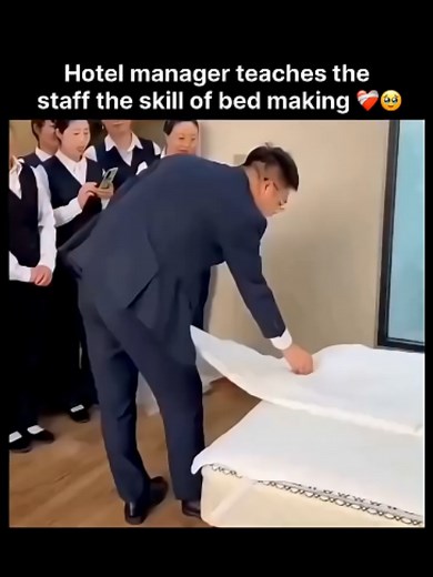 Hotel Manager Teaches Staff Expert Bed-Making Skills