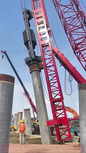 Red Piling Machine Roars into Action – Witnessing Engineering Miracles!”