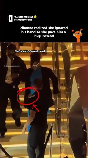 Rihanna realized she ignored his hand so she gave him a hug instead