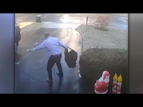 Watch: Man's epic slip down icy driveway