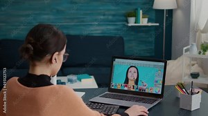 Photography student using retouching software to edit picture on laptop computer. Female editor using color grading to create multimedia design on photos, learning on online software.