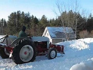 Ford 860 Tractor plowing snow.wmv