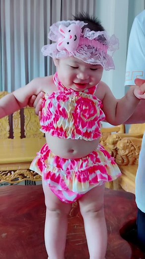 Adorable Toddler in Cute Pink Swimsuit