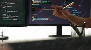 Slow motion closeup hand, back end software developer engineer for computer programming working together on debugging writing computing code, solving complex algorithms display on monitor. Burgeoning