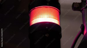 RED alert, Green and red light switching on a alarm light in a bank or high security compound building.