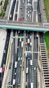 Modern transportation system aerial vertical video train and highways.