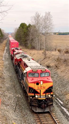 KCS 5002 north goes under the bridge
