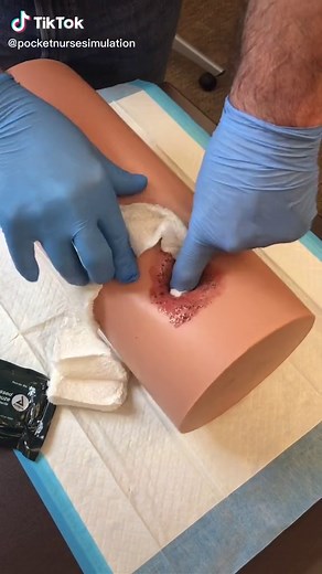 Practice packing and putting an emergency trauma dressing on a wound #emstiktok #ems #emslife #emergencymedicine #wounddressing #woundcare #medicalsimulation #traumacare #woundpacking #paramedic #paramedicstudent #emsstudent #emt #training