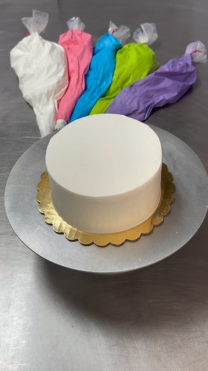 16K views · 10K reactions | Behind the Scenes Take a look as we decorate our “Vanessa Design” cake! Available to order online- and customize your own message on top! Do you want to see more videos like this?? #dorothyannbakery #cakedecorating #buttercreamcake #buttercream #woodburymn #mywoodbury | Dorothy Ann Bakery & Cafe | Facebook