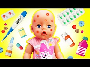 Baby Emily doll is ill! Kids pretend to play doctor for the baby born doll. Nursery toys for kids.