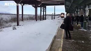 Commuters get covered in snow by train