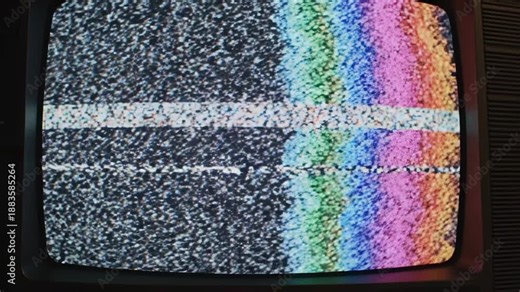 Static screen of the TV with rainbow bars: A vintage television screen displays an intriguing combination of static noise and colorful rainbow bars, offering a unique visual experience