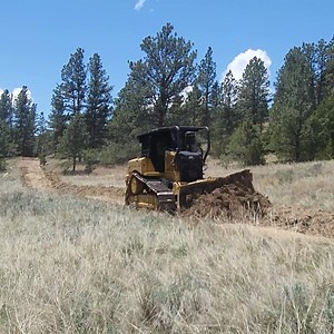 2025 Wyo-Fire Event Update: Today the Fire Finance Workshop learned about Fire Cost and Claims. The Students learned who pays for what while suppressing a wildland fire and how firefighters claim repairs if something breaks or gets lost on a wildland fire. The Dozer Academy continued constructing fire breaks and learned skills while having an assigned Heavy Equipment Boss. The Dozer Academy was also joined by our neighbors to the east. South Dakota Wildland Fire brought students and two dozers t