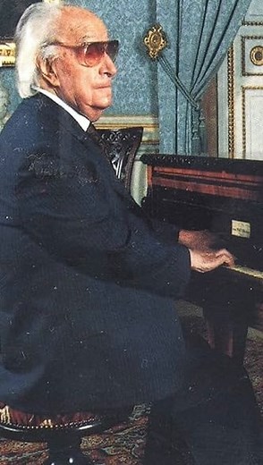 Joaquín Rodrigo (1901-1999), the blind Spanish composer who wrote the famous Concierto de Aranjuez (1939) written for the guitar but here played by Rodrigo himself on the piano because he was a pianist and because he conceived it on his piano, composing in Braille, and dictating every note, instrumentation, rhythm bar by bar to a copyist. He is playing the heart-wrenching 2nd movement, the Adagio. The background of it is worth remembering… The name of the concerto refers to the gardens of the Ro