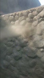 Stone retaining wall restoration using a Dry Shotcrete Method also known as Gunite. Premier Gunite
