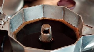 clip-1069321450-hot-coffee-open-moka-steam-aroma-spreading