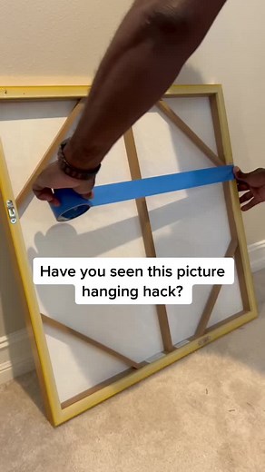 Innovative Picture Hanging Hack for Concrete Walls