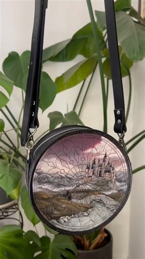 Angelus Direct | Paints, Dyes, Cleaners for Shoes & More on Instagram: "I ADOREEE this piece. So gorgeous. 😍 When art meets function, magic happens. @malevolentleather created this stunning Mountain Kingdom Round Bag, a one-of-a-kind, hand-painted leather purse that's built to last and meant to be well loved. 🎨 THE DETAILS: • Hand-painted rose window design inspired by Gothic architecture • Premium Hermann Oak vegetable-tanned leather • Angelus Leather Paint for vibrant, flexible, permanent co