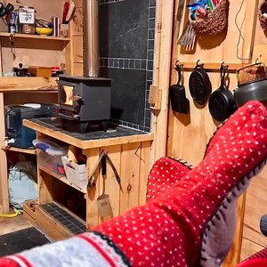 Cozy cabin vibes with a warm fire, rustic charm, and a snug getaway. Perfect spot to unwind and enjoy the simple things in life. 🔥✨ @tinycabinsofmaine Cozy toes in the tiniest tiny cabin. Roxie❤️ | Cubic Mini Wood Stoves