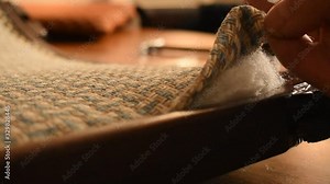 Master restores the antique armchair. Classical technology. Repair of furniture. Master restores the antique armchair. Classical technology. Trims the fabric Stock Video