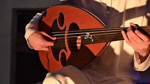 An Arab musician plays the oud, a beloved traditional string instrument in Arabic music