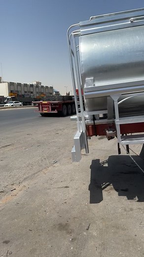 Exploring a Metallic Tanker Truck in Urban Setting