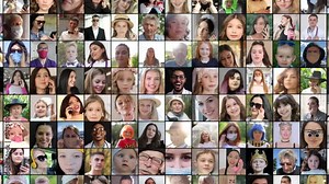 A large number of faces of smiling, happy people of different ages and nationalities.