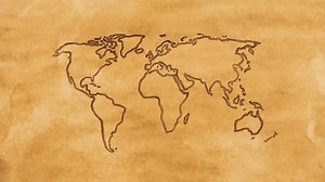 A world map on an ancient piece of paper. 4k video. The camera zooms in. Out of focus.