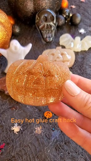 This hot glue craft hack is great for easy DIY project. All you need is just hot glue sticks, a glue gun, glitter and a silicone mold. #halloweenhack #glitter #createdbyandi #hack #dollartreediy #creativelife #centerpiece #tabledecor #halloweenhack #tiktok #home #fall #fun #creativity #diyproject #diy #dollartree #ideas #easy ##pumpkin #pumpkinseason #halloween #halloweendecor #autumn #handmade #glue #halloween2022