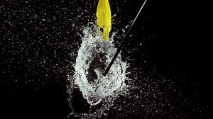 Arrow bursting a water balloon | Premium Stock Video Footage