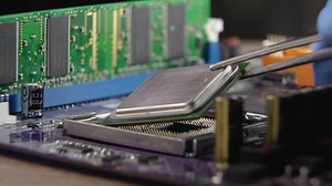 High tech. The process of installing a processor on a computer motherboard. Close-up 4K