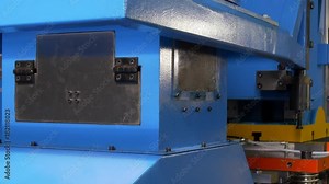 Cutting holes perforation stamping of metal sheets on industrial CNC machine. Automation of work. Refrigeration and ventilation equipment and air conditioners. Modern technologies.