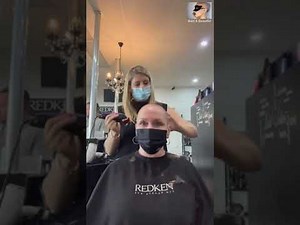 Middle aged lady crying during headshave (emotional)