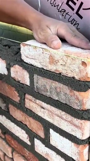 Process of building solid red brick wall with cement